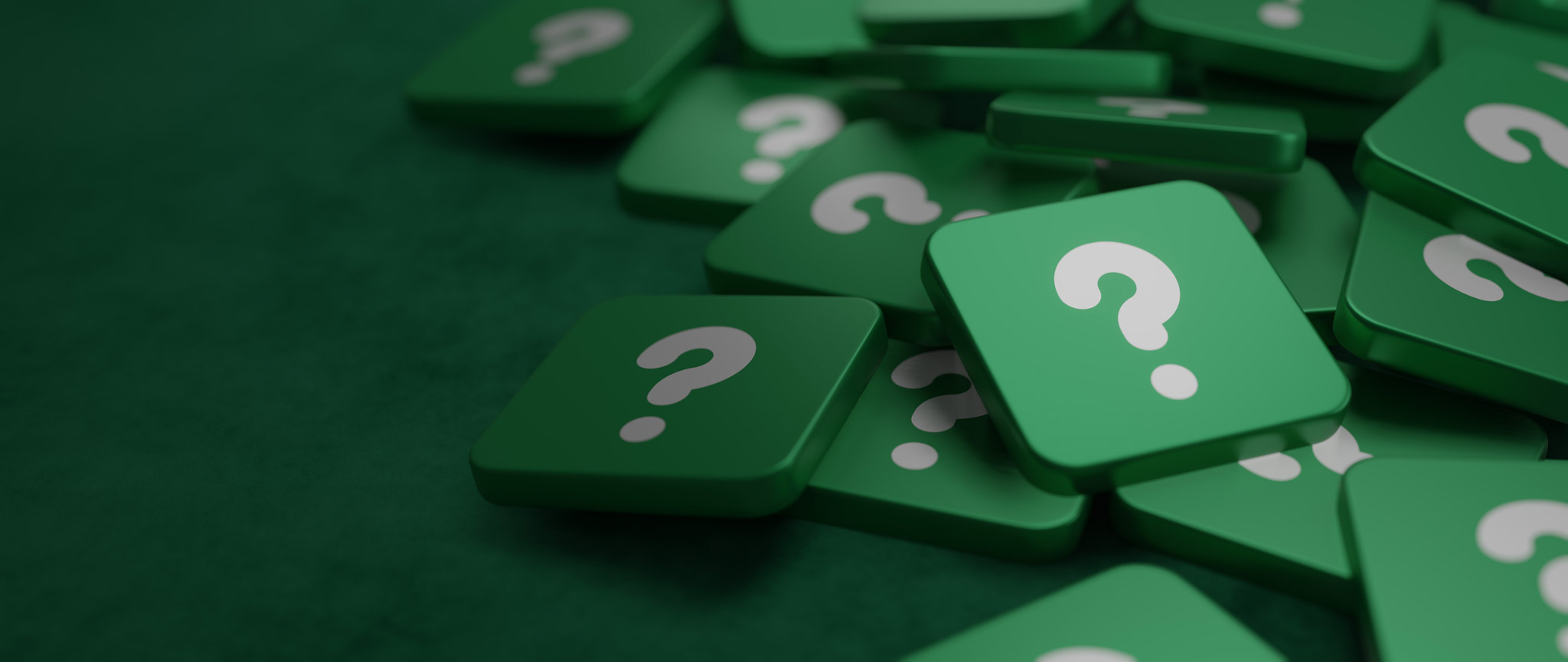 A series of tiles with question marks on them in a pile